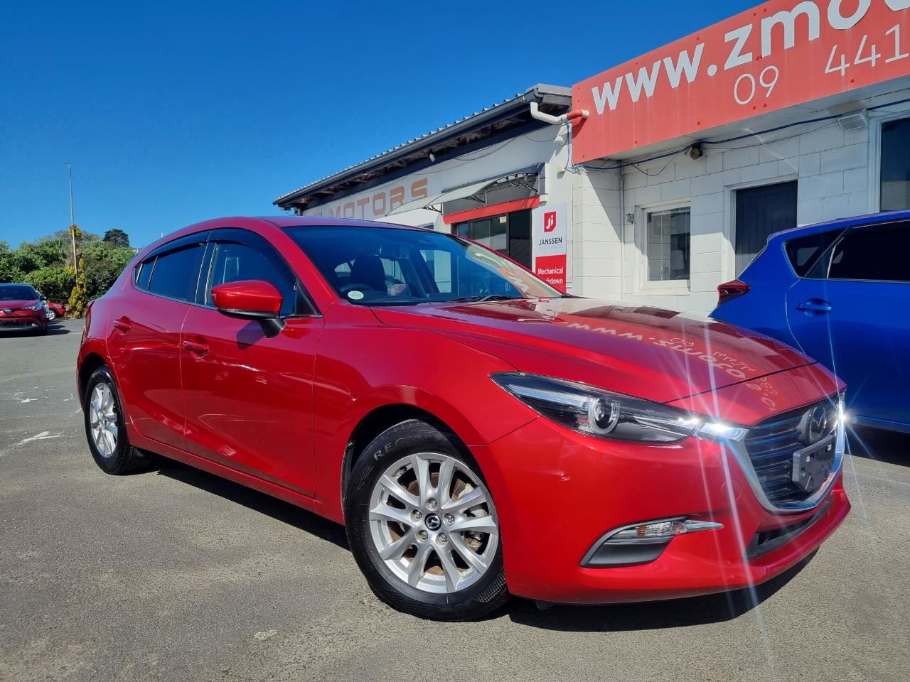 2017 red Mazda Axela