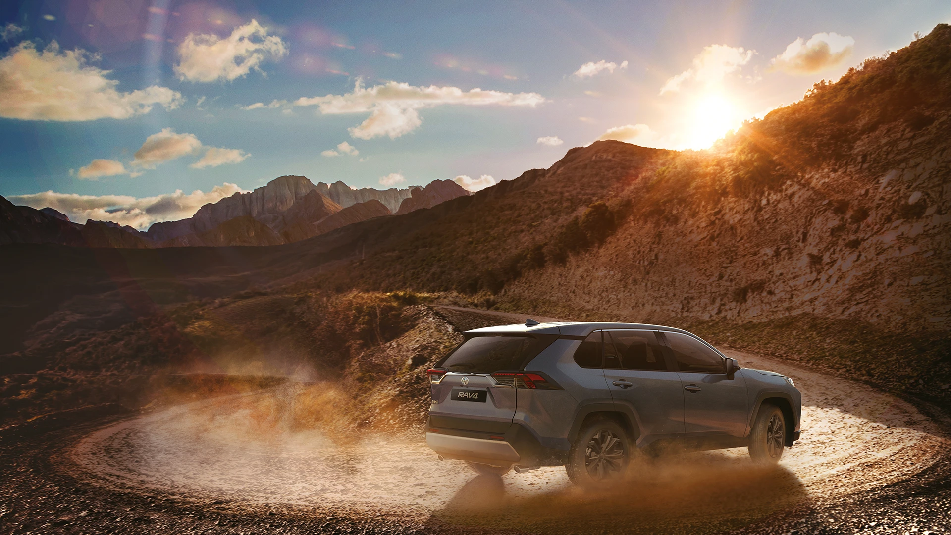 An image of the Toyota RAV driving on a dusty road