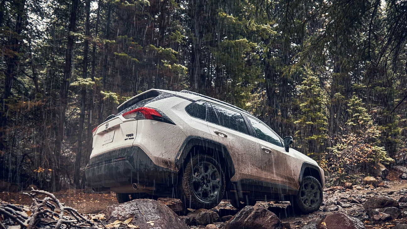 An image of Toyota RAV 4 traversing rocky terrain