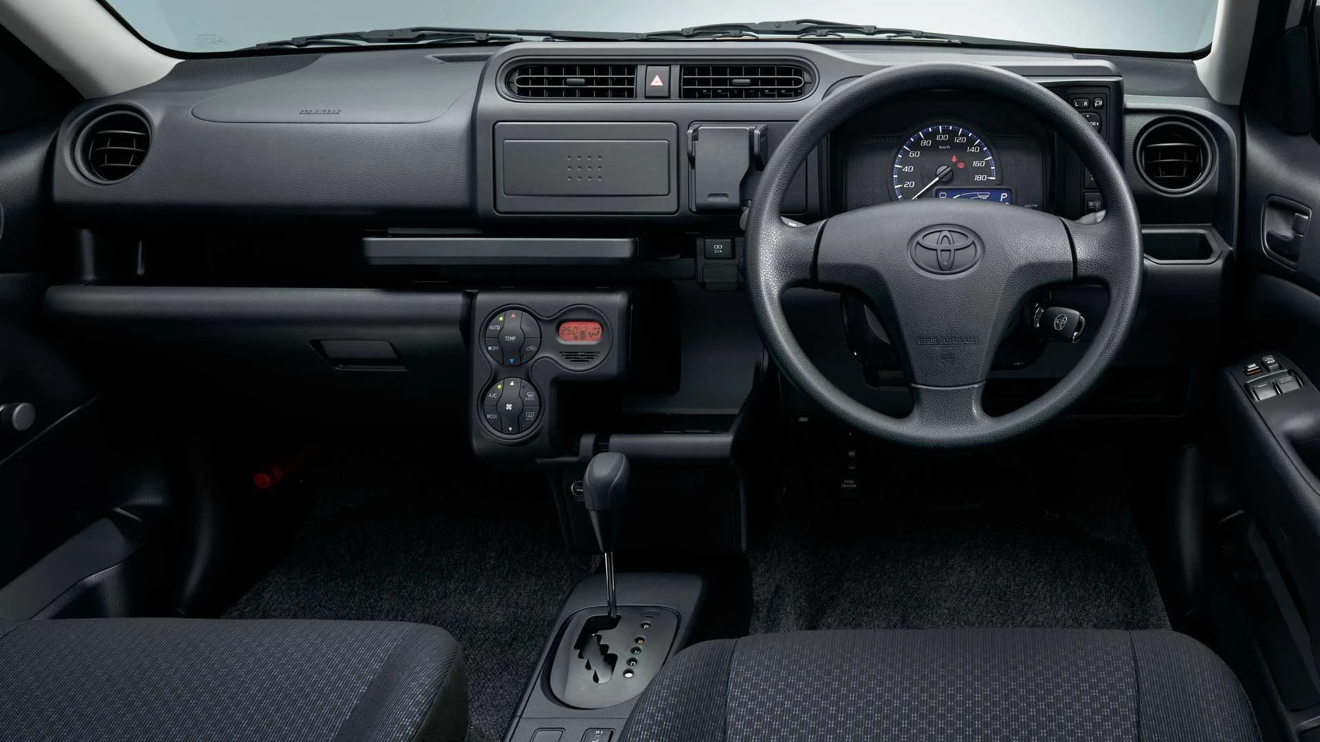 An image of the Probox's driver's cabin showing its dashboard