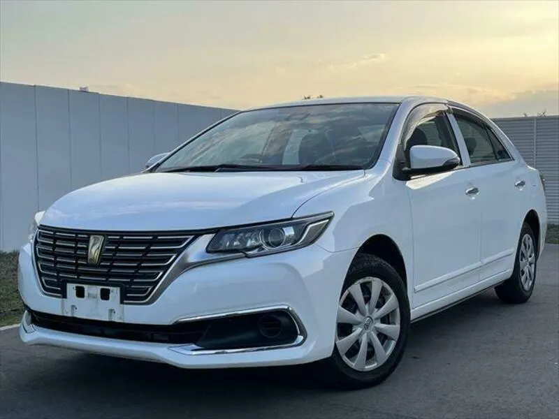 The Toyota Premio for sale in Kenya - a white Toyota Premio in a sales yard